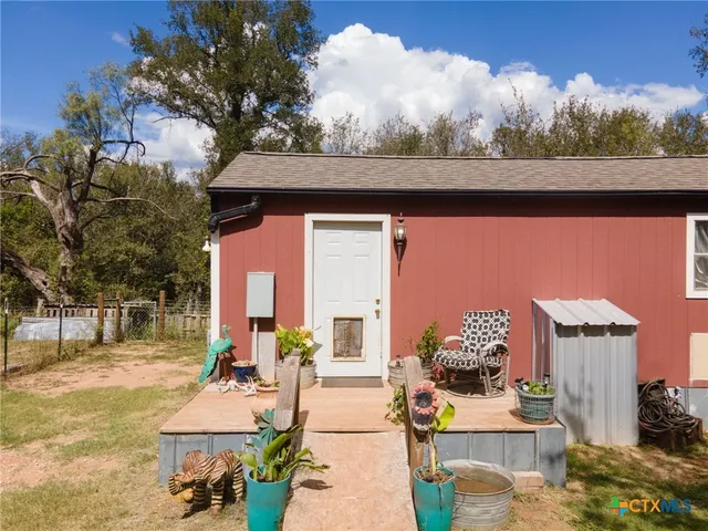 a backyard of a house with seating space