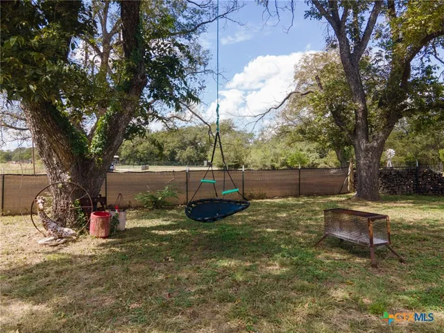 a backyard of a house with entertaining space
