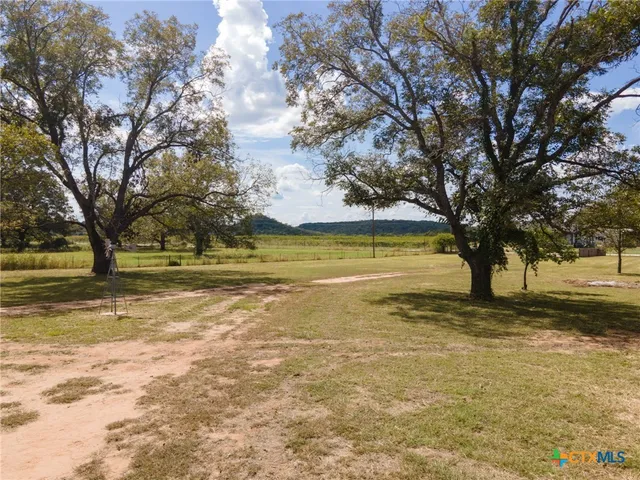 a view of an ocean with trees