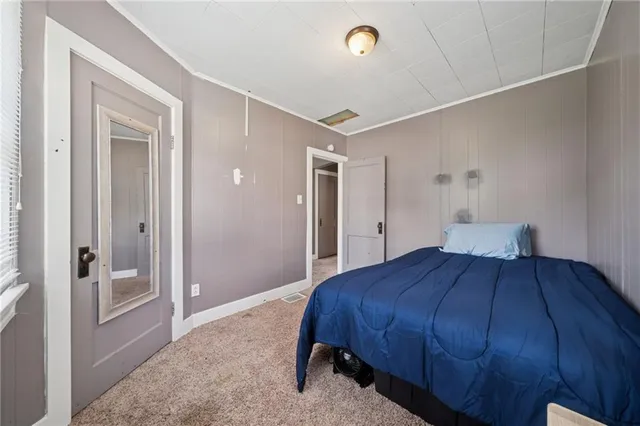 a bedroom with a bed and closet