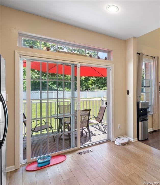 5 Case Court Monroe, NY 10950 - Photo 11 of 35 a view of a living room with a floor to ceiling window and wooden floor