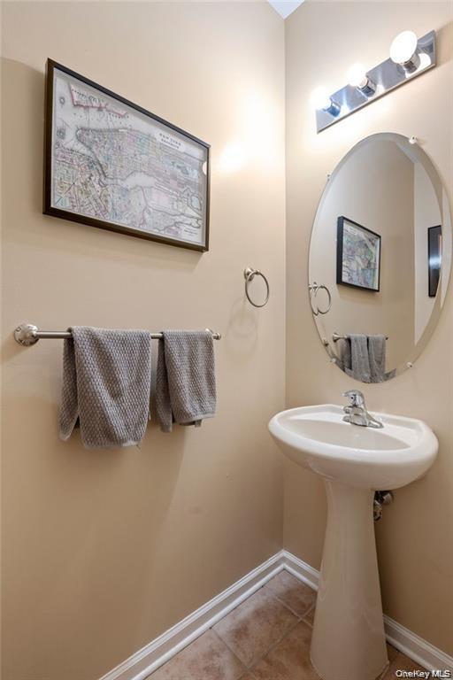 5 Case Court Monroe, NY 10950 - Photo 12 of 35 a bathroom with a sink and mirror