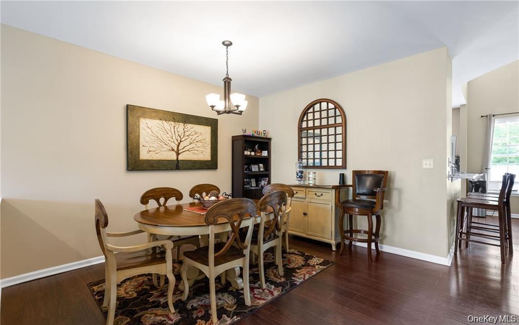 5 Case Court Monroe, NY 10950 - Photo 5 of 35 a dining room with furniture a chandelier and wooden floor