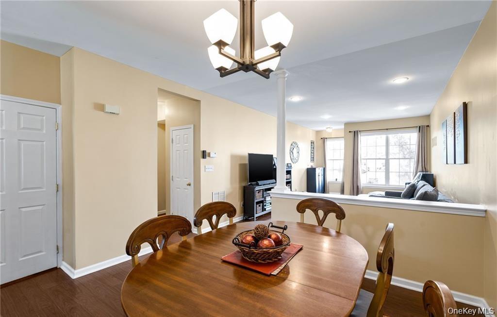 5 Case Court Monroe, NY 10950 - Photo 6 of 35 a room with furniture a dining table and a chandelier