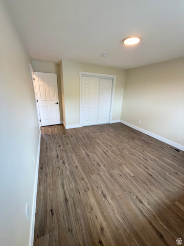 450 13800 South, Unit 2 Draper, UT 84020 - Photo 14 of 21 Room featuring wood-finish flooring, light neutral wall paint, and white trim