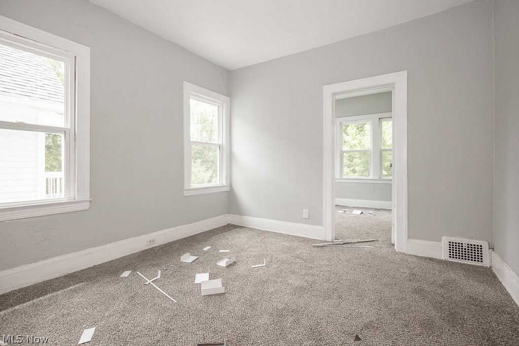 1000 Eddy Road Cleveland, OH 44108 - Photo 33 of 38 Carpeted empty room featuring baseboards