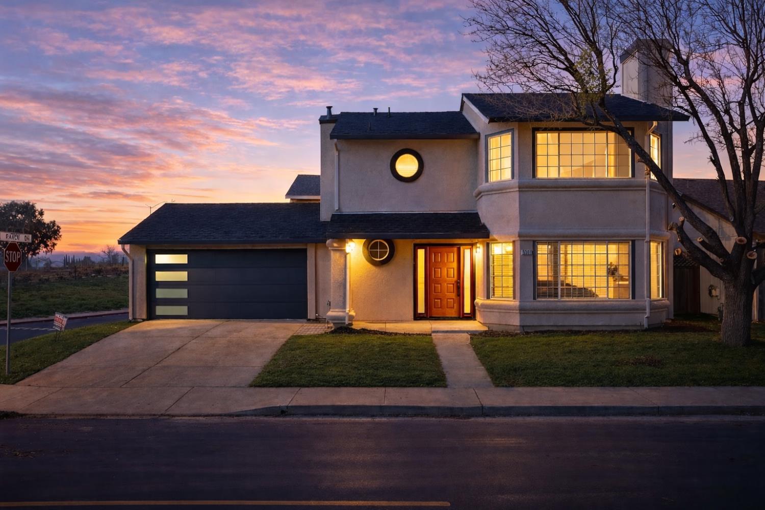 a front view of a house with a yard