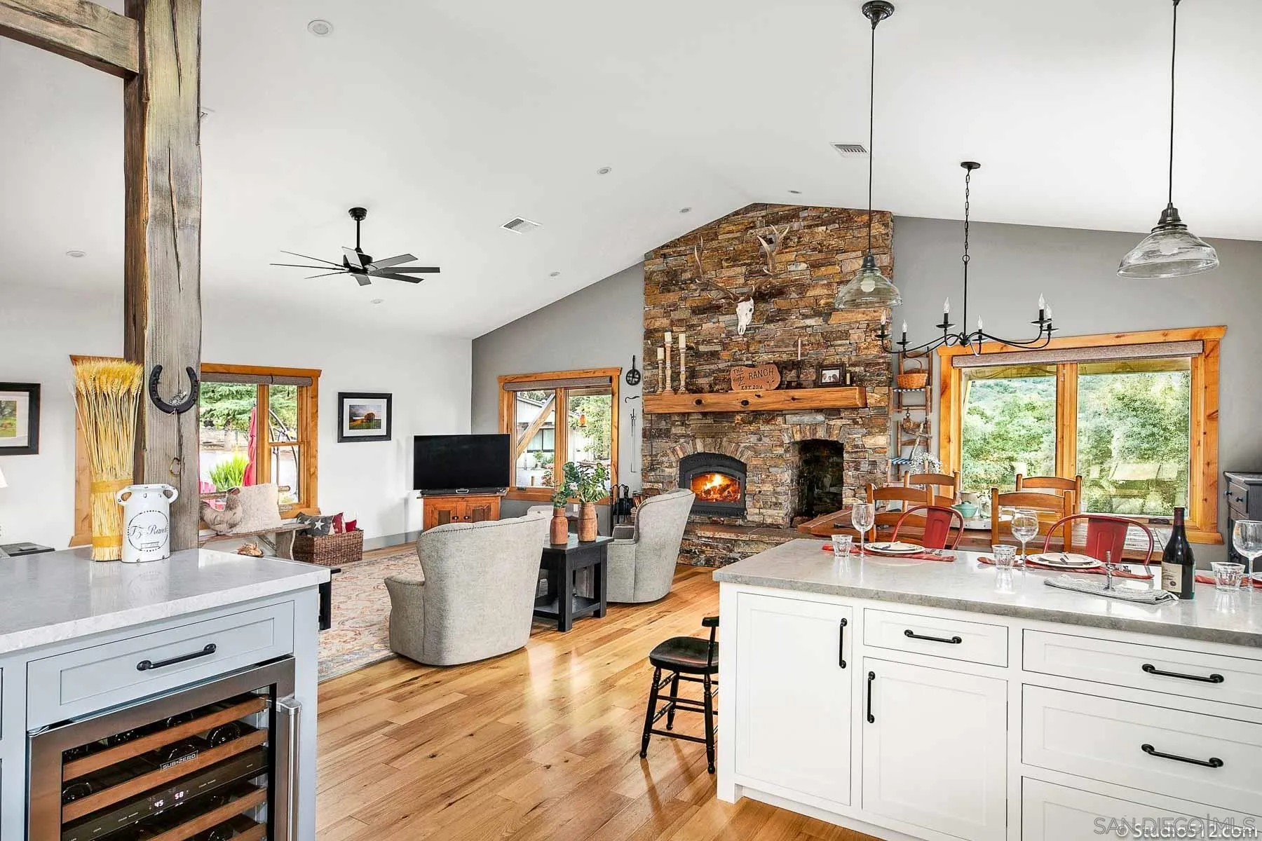 3208 Eagle Peak Road Julian, CA 92036 - Photo 33 of 65 a living room with furniture a fireplace and a flat screen tv