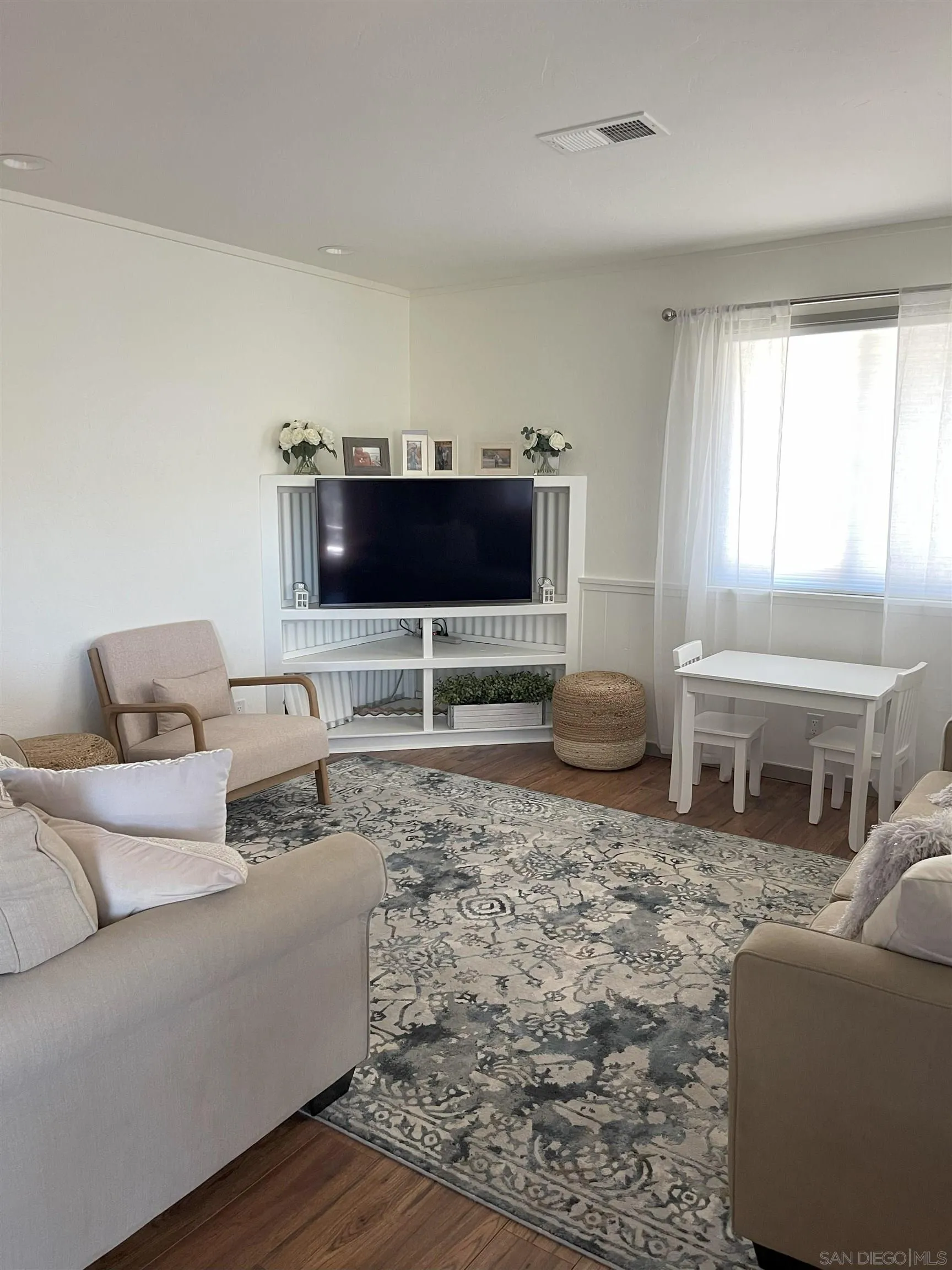 3208 Eagle Peak Road Julian, CA 92036 - Photo 55 of 65 a living room with furniture and a flat screen tv