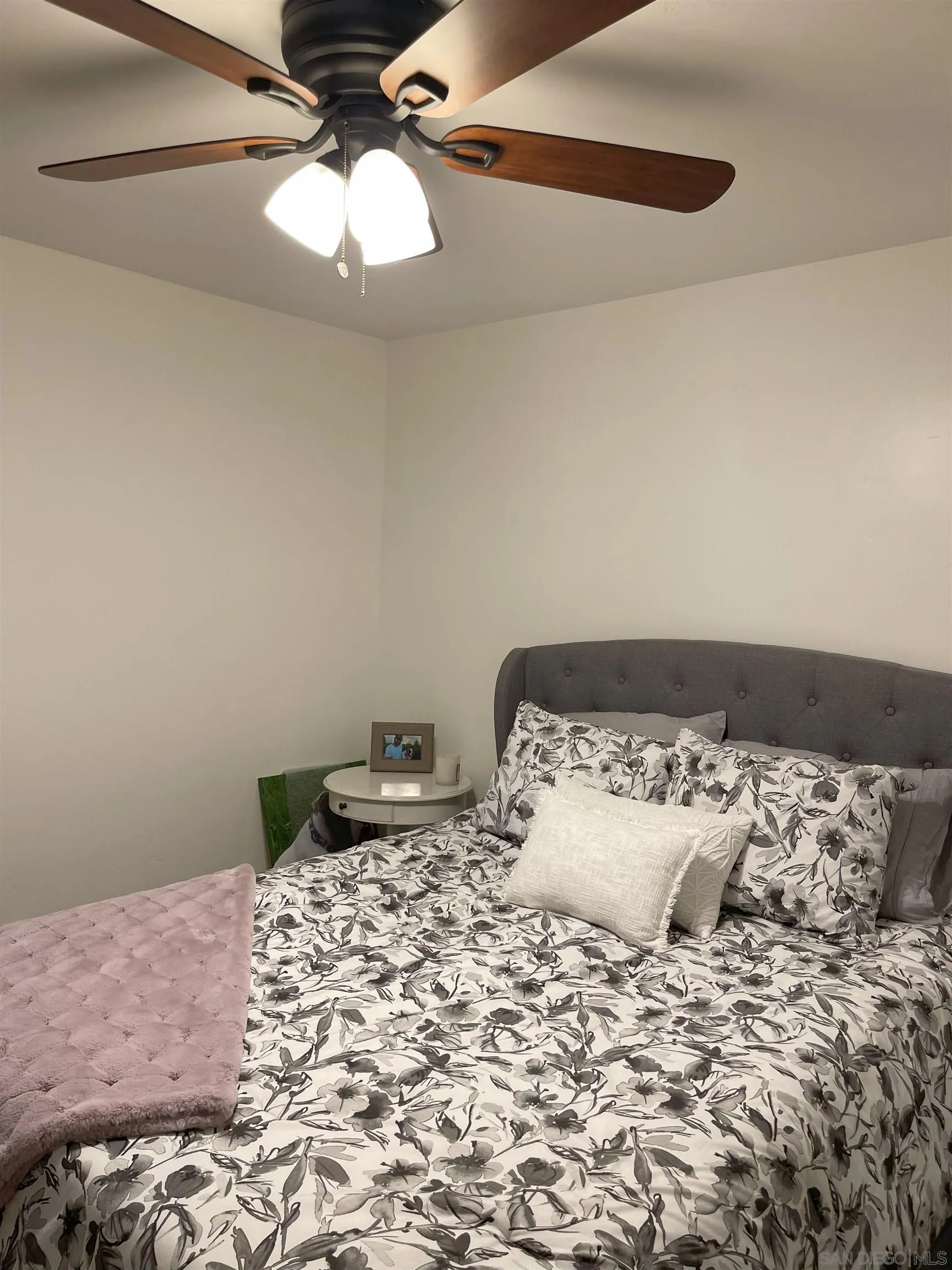 3208 Eagle Peak Road Julian, CA 92036 - Photo 59 of 65 a bedroom with a bed and a chandelier