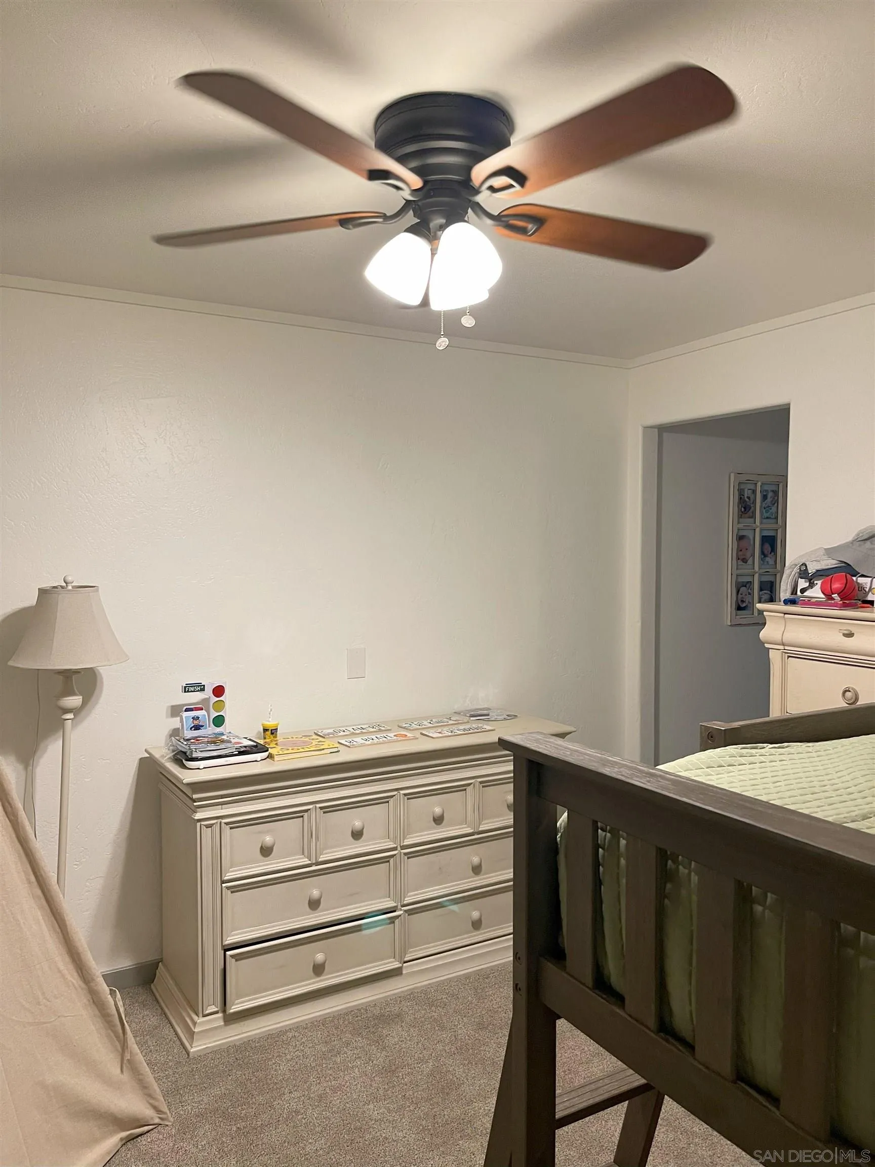 3208 Eagle Peak Road Julian, CA 92036 - Photo 62 of 65 a bedroom with a bed and a chandelier