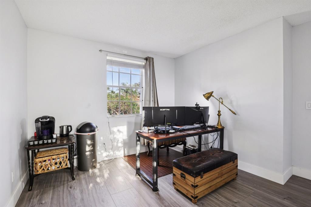 972 Azure Lane Weston, FL 33326 - Photo 12 of 61 a living room with furniture and a window