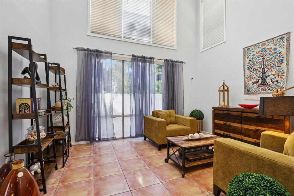 972 Azure Lane Weston, FL 33326 - Photo 25 of 61 a living room with furniture and a window