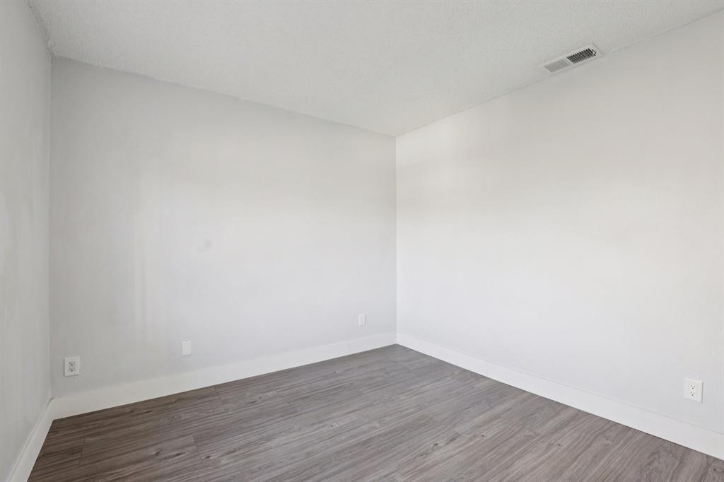 972 Azure Lane Weston, FL 33326 - Photo 38 of 61 a view of an empty room with wooden floor