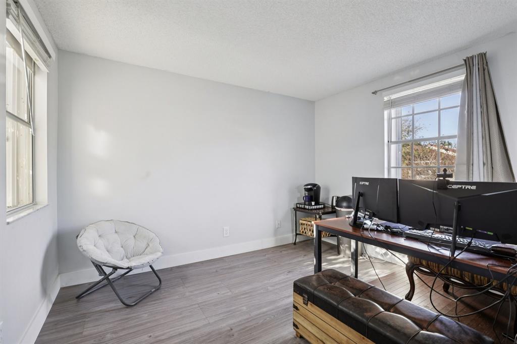972 Azure Lane Weston, FL 33326 - Photo 39 of 61 a view of a workspace with furniture and a window