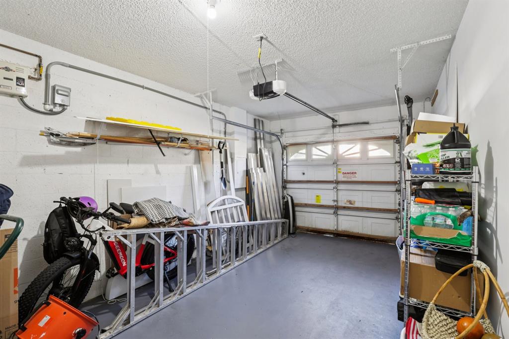 972 Azure Lane Weston, FL 33326 - Photo 43 of 61 The garage provides ample space for vehicle parking and additional storage.