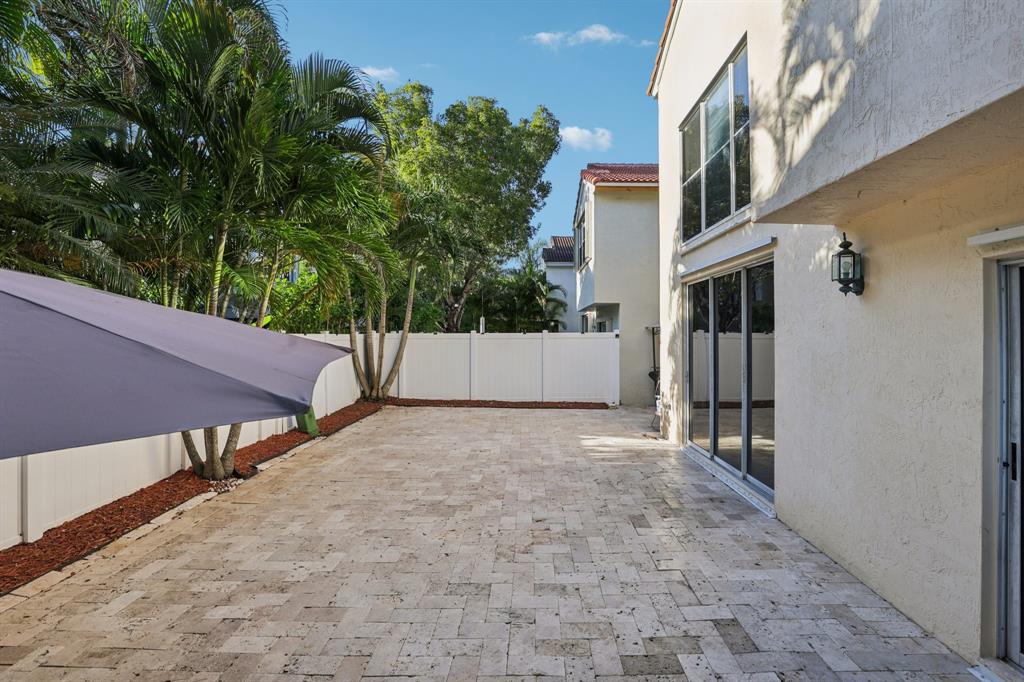 972 Azure Lane Weston, FL 33326 - Photo 46 of 61 a view of an outdoor space and front view of a house