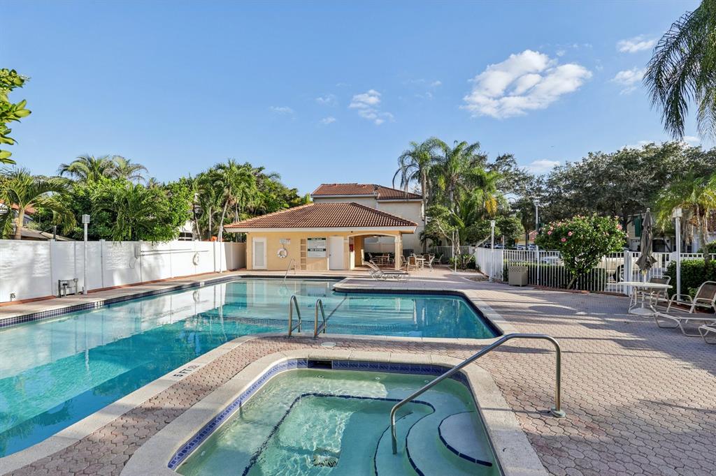 972 Azure Lane Weston, FL 33326 - Photo 47 of 61 a view of a swimming pool with a patio