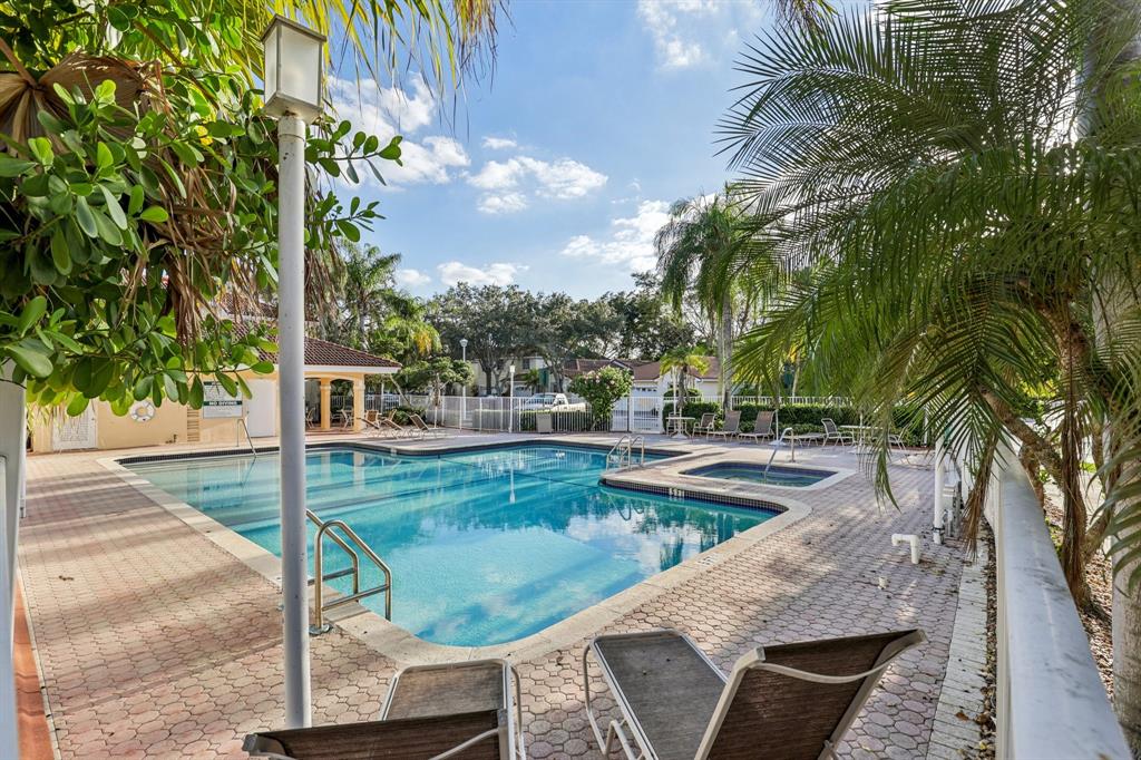 972 Azure Lane Weston, FL 33326 - Photo 48 of 61 a view of a swimming pool with a patio