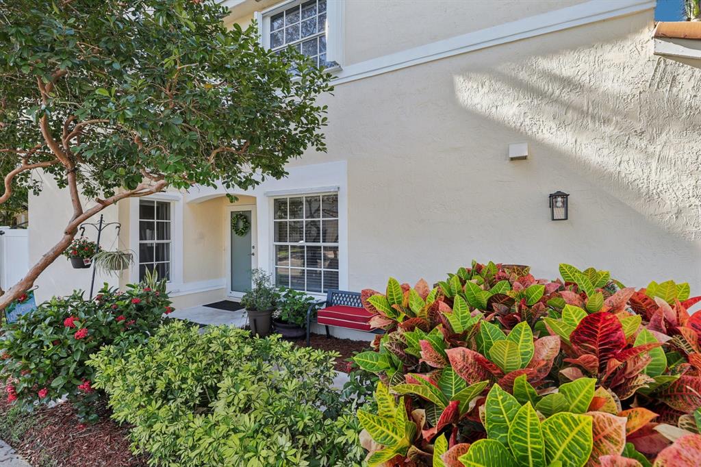 972 Azure Lane Weston, FL 33326 - Photo 51 of 61 a flower plants in front of a building