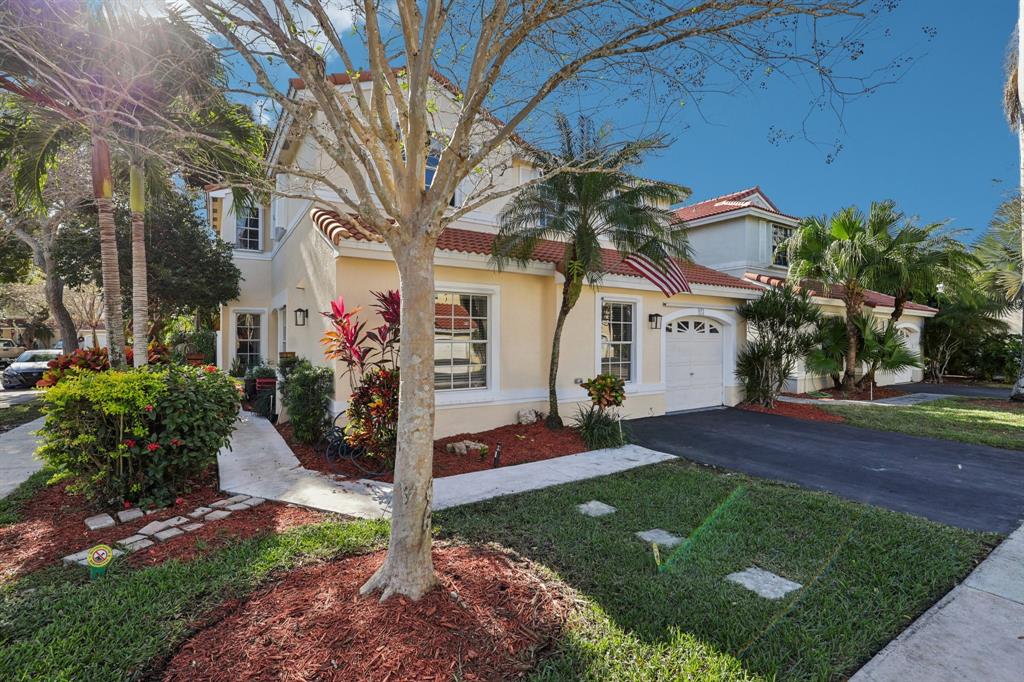 972 Azure Lane Weston, FL 33326 - Photo 53 of 61 a front view of a house with a yard