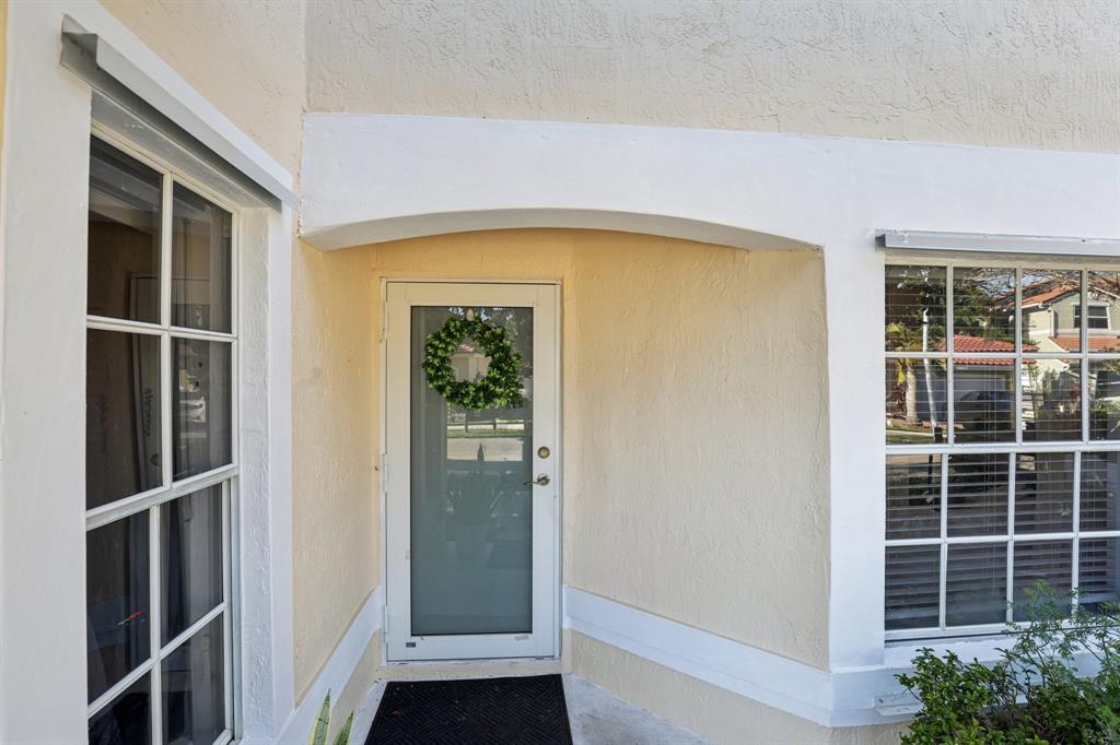 972 Azure Lane Weston, FL 33326 - Photo 55 of 61 The entryway offers a welcoming and well-defined introduction to the home, creating an immediate sense of comfort and flow.
