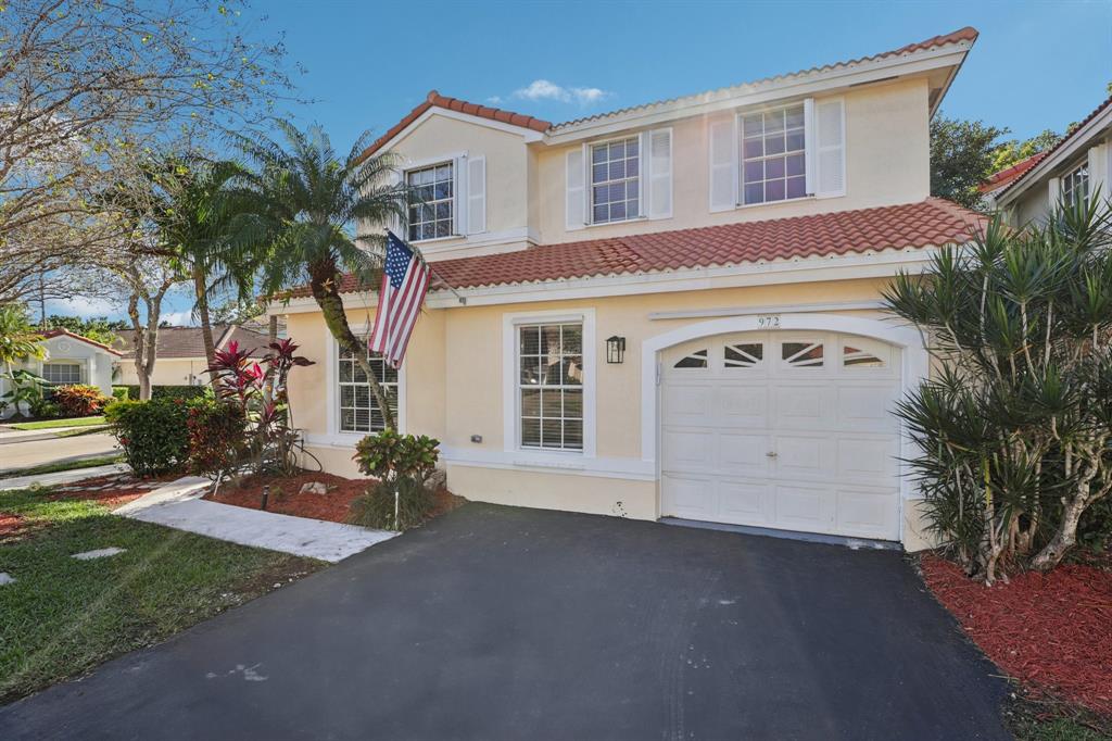 972 Azure Lane Weston, FL 33326 - Photo 57 of 61 a view of a house with a yard