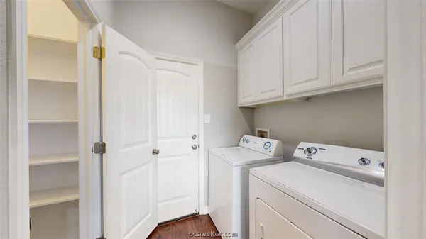 a view of storage and utility room with washer and dryer