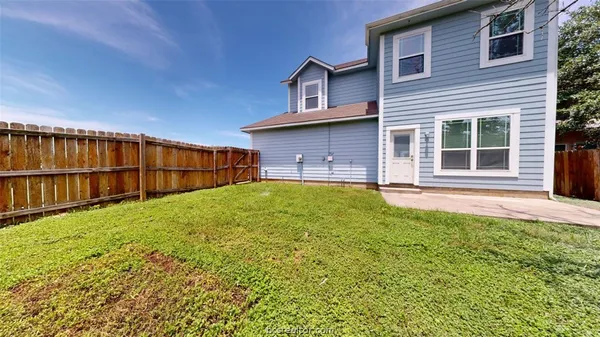 a picture of a bench in front of a wall