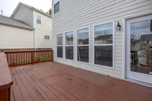 a view of a house with a yard and sitting area