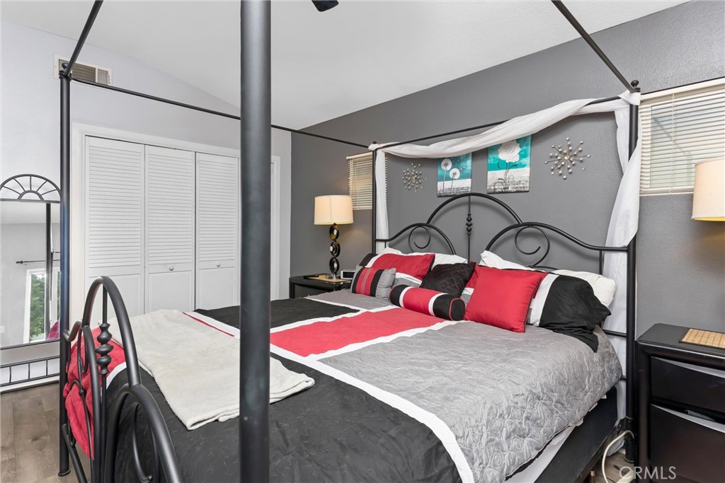 2165 Mintzer Street Colton, CA 92324 - Photo 17 of 40 a bedroom with a bed and a mirror