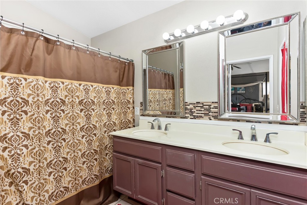 2165 Mintzer Street Colton, CA 92324 - Photo 18 of 40 a bathroom with a sink and a mirror
