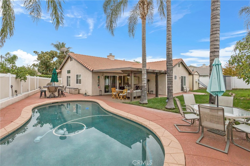 2165 Mintzer Street Colton, CA 92324 - Photo 26 of 40 a view of a house with swimming pool and sitting area