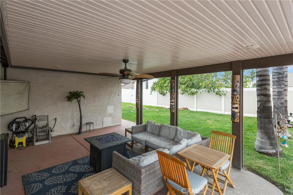 2165 Mintzer Street Colton, CA 92324 - Photo 29 of 40 a living room with furniture and a floor to ceiling window