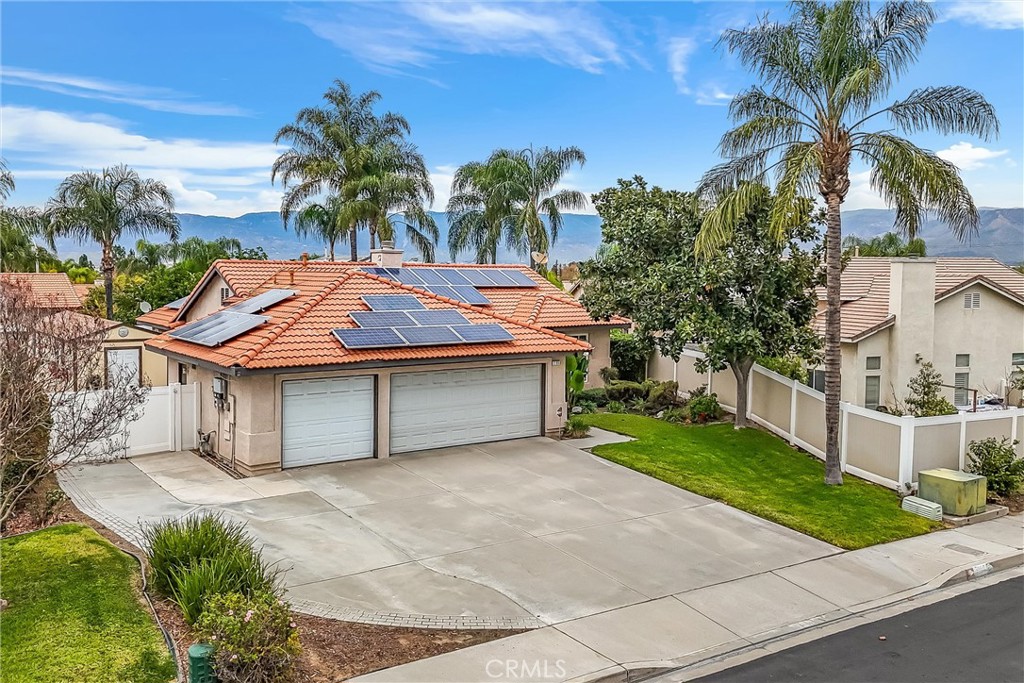 2165 Mintzer Street Colton, CA 92324 - Photo 34 of 40 a house with a garden and a yard