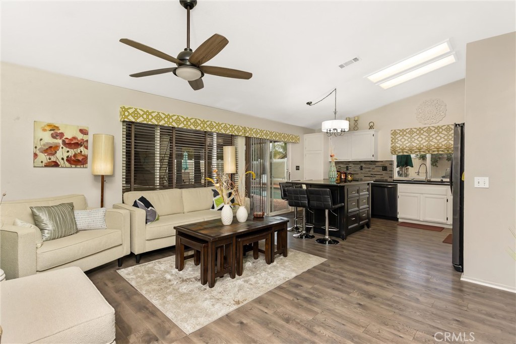 2165 Mintzer Street Colton, CA 92324 - Photo 10 of 40 a living room with furniture kitchen view and a chandelier