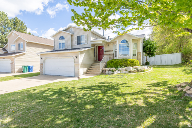 4544 Glasmann Way Ogden, UT 84403 - Photo 1 of 1 Tri-level home with an attached garage and driveway