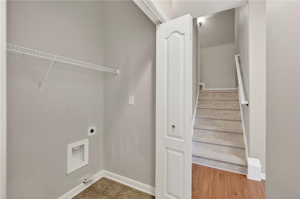 1186 Lake Point Way Suwanee, GA 30024 - Photo 17 of 35 a view of an empty walk in closet