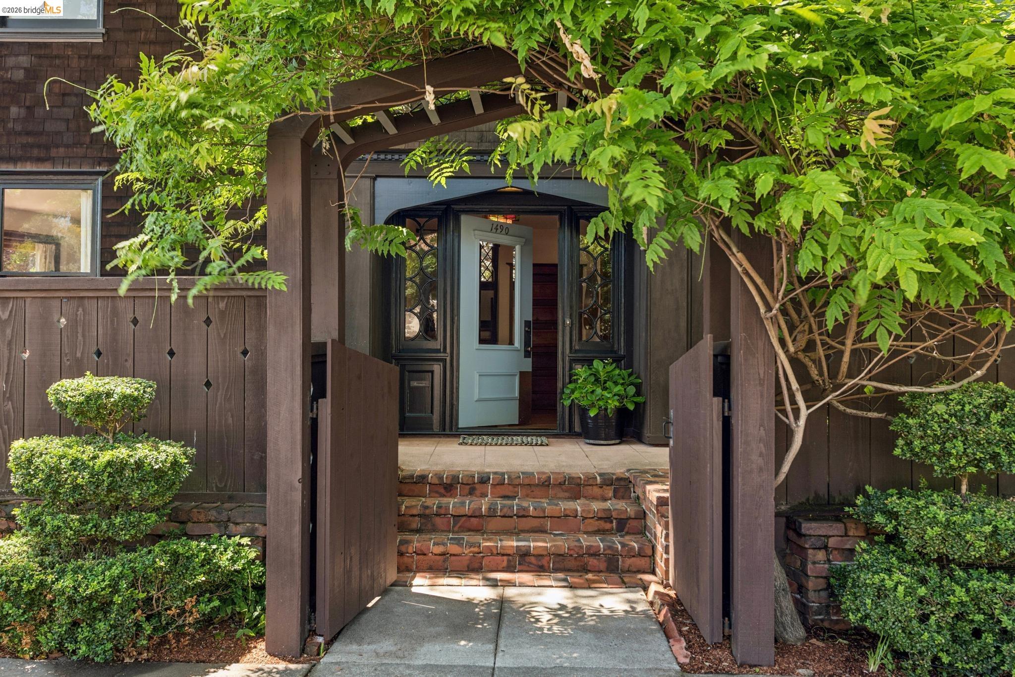 1490 Arch Street Berkeley, CA 94708 - Photo 3 of 57 a front view of a house with garden