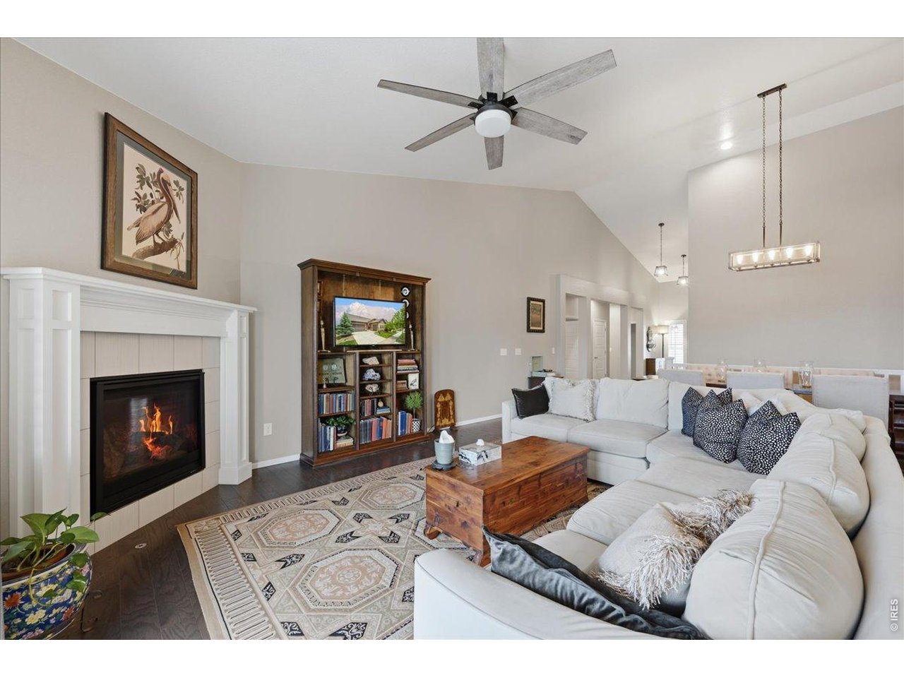 6096 Story Road Timnath, CO 80547 - Photo 9 of 50 a living room with furniture and a fireplace