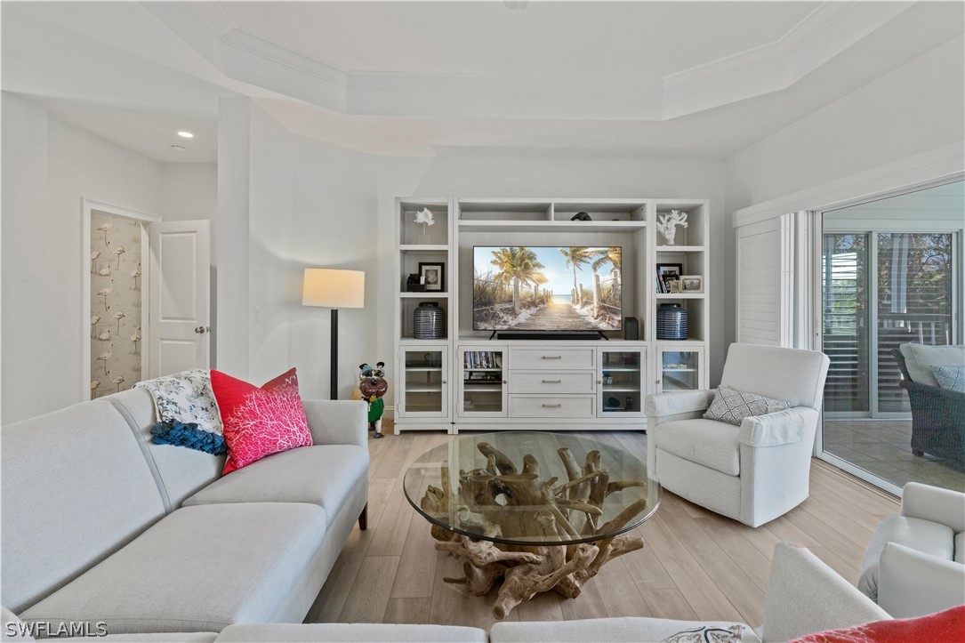 5294 Umbrella Pool Road Sanibel, FL 33957 - Photo 11 of 44 a living room with furniture and a flat screen tv