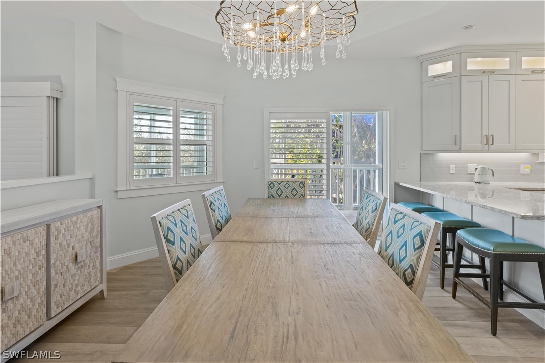 5294 Umbrella Pool Road Sanibel, FL 33957 - Photo 12 of 44 a living room with furniture and a chandelier