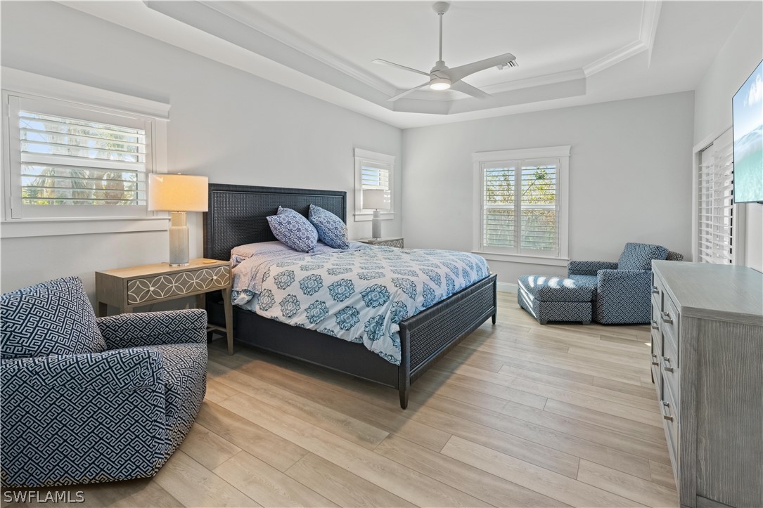 5294 Umbrella Pool Road Sanibel, FL 33957 - Photo 17 of 44 a bedroom with a bed couch and window