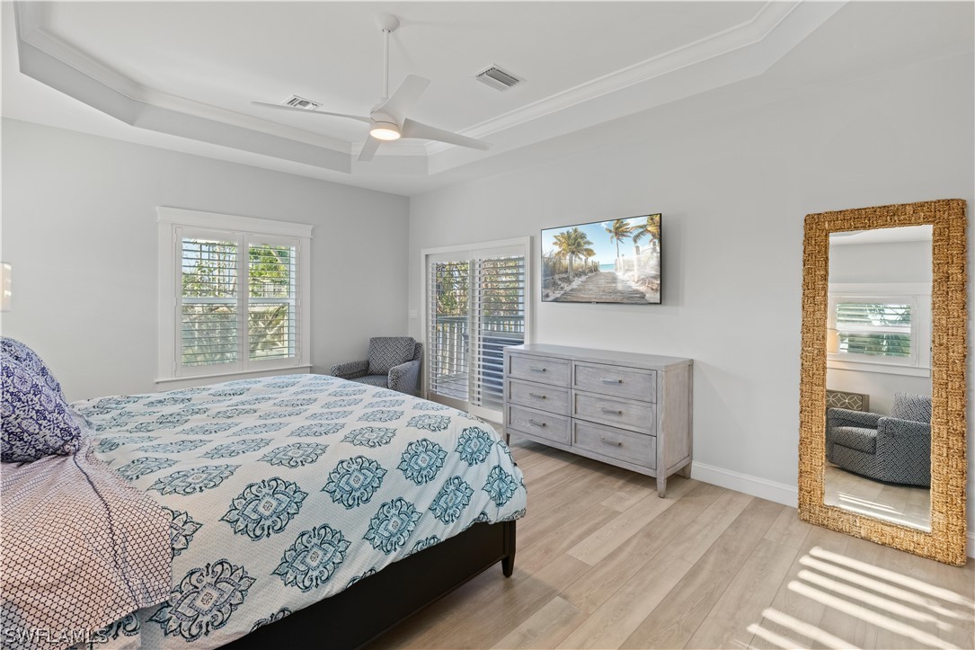 5294 Umbrella Pool Road Sanibel, FL 33957 - Photo 19 of 44 a bedroom with a bed and a window