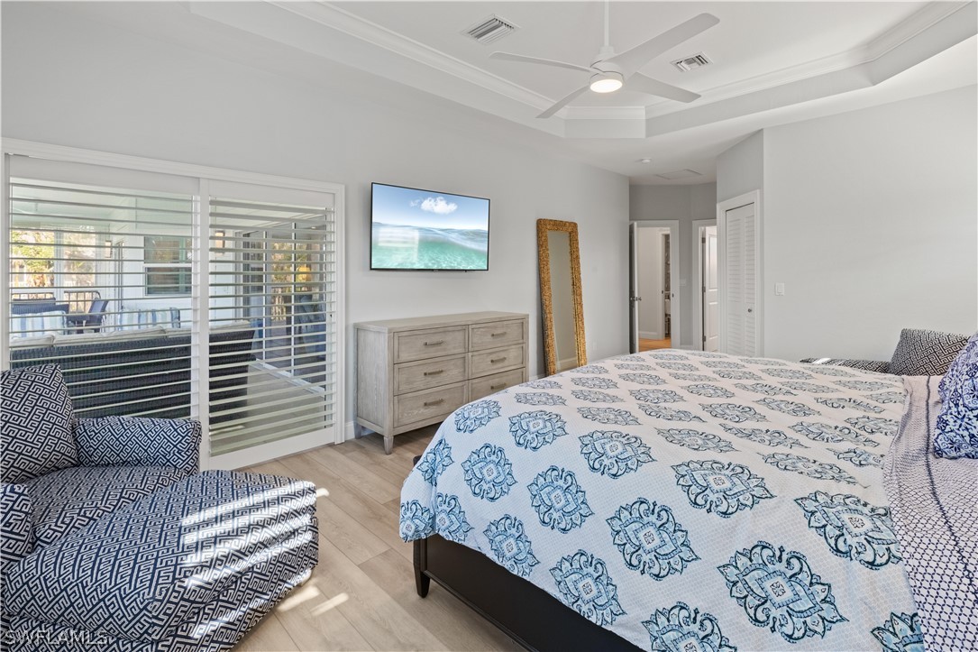 5294 Umbrella Pool Road Sanibel, FL 33957 - Photo 20 of 44 a bedroom with a bed dresser and a window