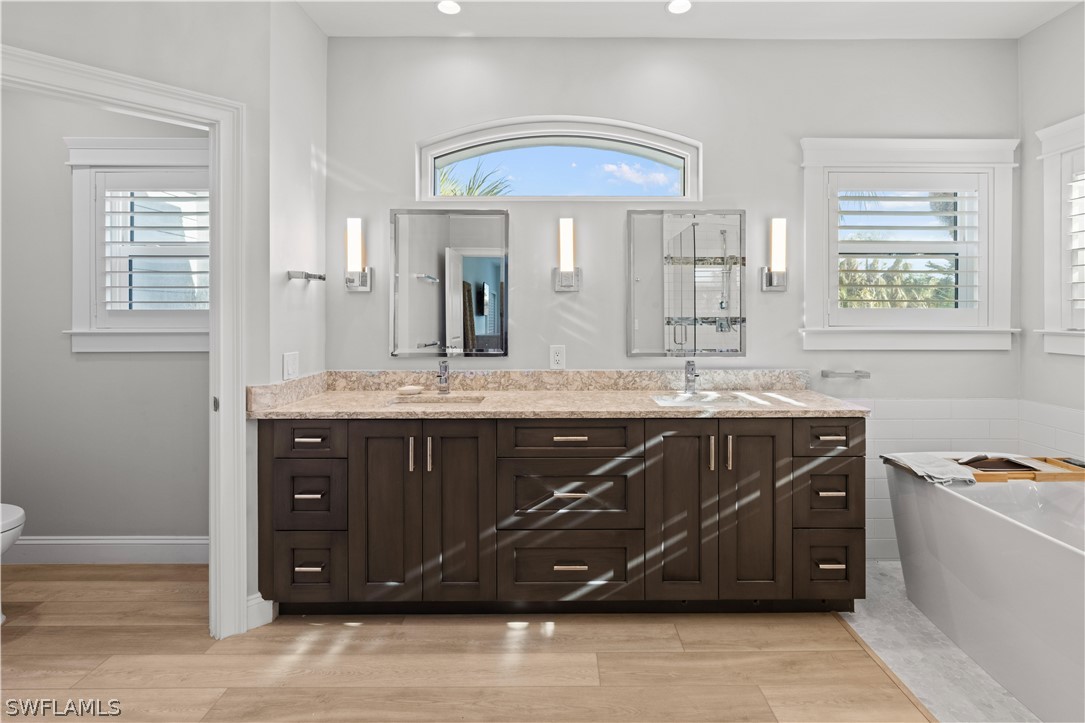 5294 Umbrella Pool Road Sanibel, FL 33957 - Photo 23 of 44 a bathroom with a sink vanity and mirror
