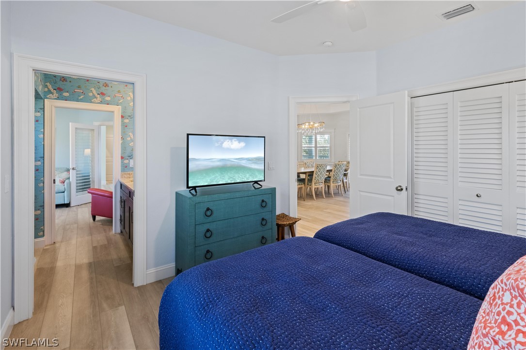 5294 Umbrella Pool Road Sanibel, FL 33957 - Photo 28 of 44 a bedroom with a bed and a mirror