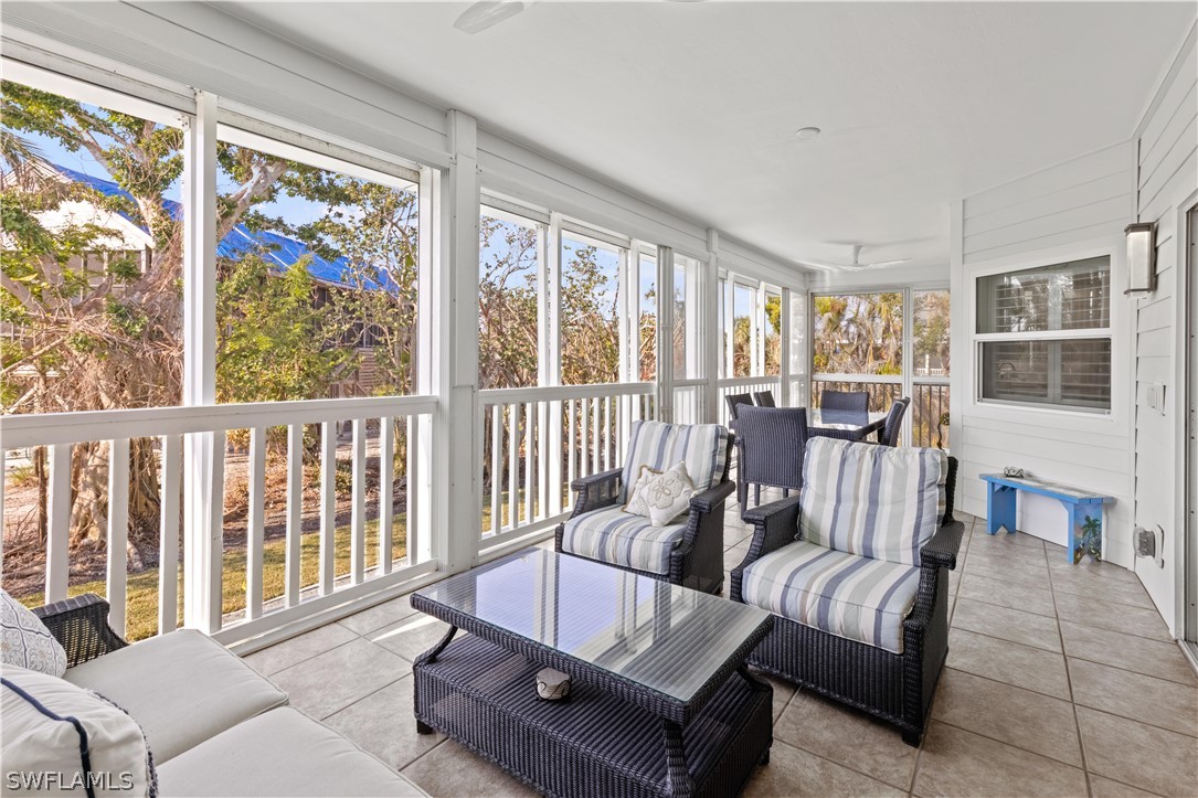 5294 Umbrella Pool Road Sanibel, FL 33957 - Photo 31 of 44 a living room with furniture and a window