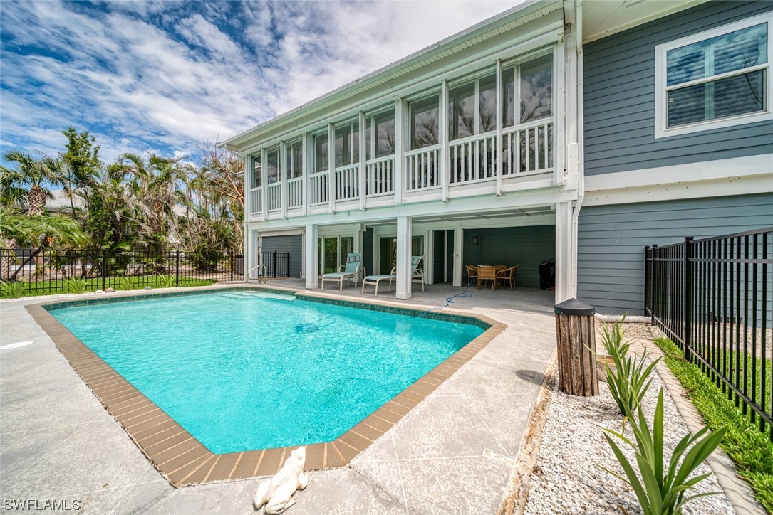 5294 Umbrella Pool Road Sanibel, FL 33957 - Photo 35 of 44 a view of a house with a swimming pool