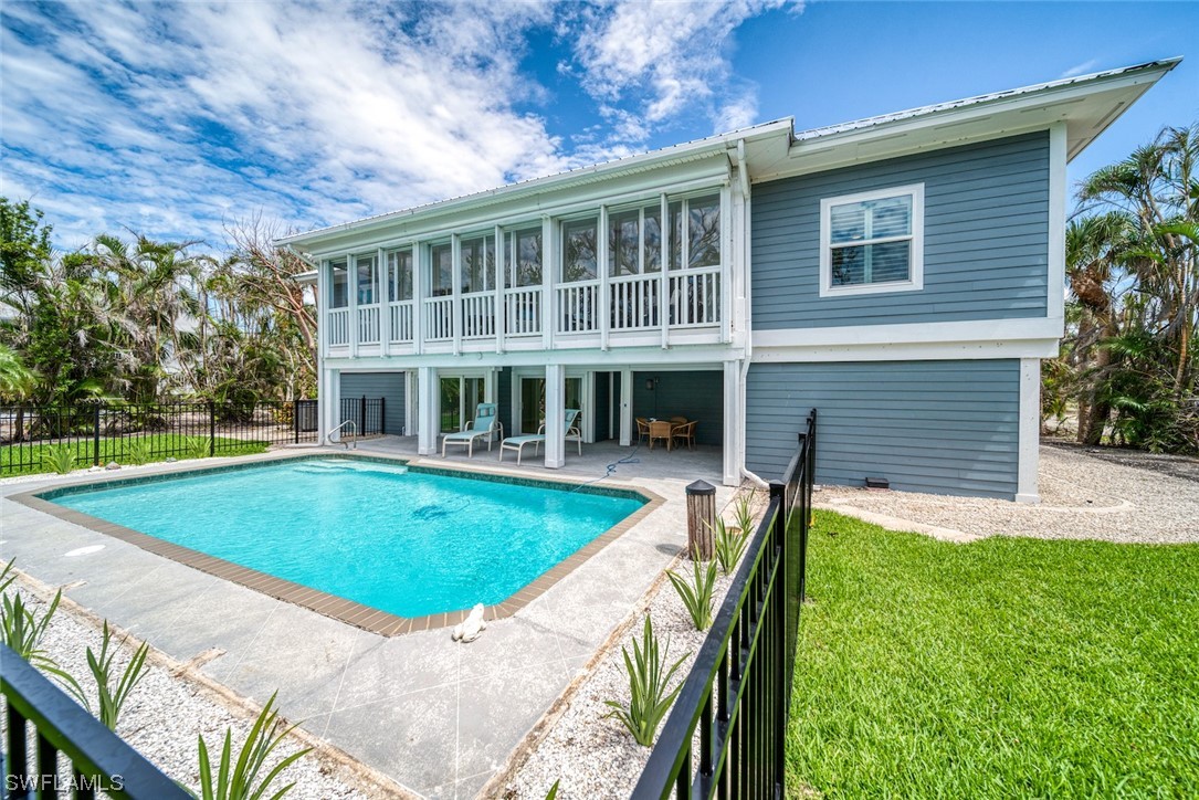 5294 Umbrella Pool Road Sanibel, FL 33957 - Photo 36 of 44 a view of a house with a swimming pool